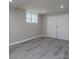Bedroom with gray walls, recessed lighting, gray wood-look floors, and a double door closet at 2617 Shady Lane Ave, Concord, NC 28027