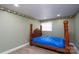 Simple bedroom with wood-look flooring and a small window at 2617 Shady Lane Ave, Concord, NC 28027