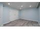 Bedroom with light blue walls, recessed lighting, gray wood-look floors, and a double door closet at 2617 Shady Lane Ave, Concord, NC 28027