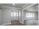 Open-concept foyer with decorative door and sidelights, complemented by wood-look flooring at 2617 Shady Lane Ave, Concord, NC 28027