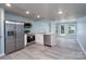 Modern kitchen with stainless steel appliances, white cabinets, and a door to the backyard at 2617 Shady Lane Ave, Concord, NC 28027