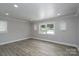 Spacious living room with recessed lighting and natural light, plus charming built-in shelving alcoves at 2617 Shady Lane Ave, Concord, NC 28027