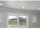 Cozy living room with neutral paint, modern recessed lighting, and large windows offering a peaceful view at 2617 Shady Lane Ave, Concord, NC 28027