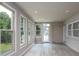 Sunroom filled with natural light through large windows and a door, offering an open and inviting atmosphere at 2617 Shady Lane Ave, Concord, NC 28027