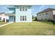 Backyard with a well-maintained lawn and patio, perfect for outdoor entertaining and relaxation at 282 Auburn View Rd, Rock Hill, SC 29730