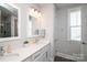 A modern bathroom features dual sinks, white cabinetry, and contemporary lighting at 282 Auburn View Rd, Rock Hill, SC 29730