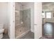 A tiled walk-in shower features a built-in bench in this well-appointed bathroom at 282 Auburn View Rd, Rock Hill, SC 29730