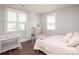 Bright bedroom features large windows and modern decor and a beige coverlet on the bed at 282 Auburn View Rd, Rock Hill, SC 29730