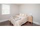 Bright bedroom features neutral decor, a large window, and light wood furnishings at 282 Auburn View Rd, Rock Hill, SC 29730
