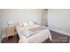 A clean and modern bedroom with neutral tones and an en suite bathroom with white fixtures at 282 Auburn View Rd, Rock Hill, SC 29730