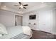 Modern bedroom features dark hardwood floors, a ceiling fan, and neutral walls and decor at 282 Auburn View Rd, Rock Hill, SC 29730