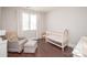 Cozy Bedroom with comfortable chair, white crib, and ample natural light from a large window at 282 Auburn View Rd, Rock Hill, SC 29730