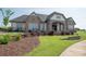 An inviting clubhouse shows off a brick and beige facade, set against a lush lawn at 282 Auburn View Rd, Rock Hill, SC 29730
