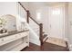 Inviting foyer with dark wood floors, console table and staircase leading to the second level at 282 Auburn View Rd, Rock Hill, SC 29730