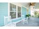 Inviting front porch with rocking chairs, a ceiling fan, and a green door for a welcoming curb appeal at 282 Auburn View Rd, Rock Hill, SC 29730