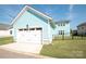 Detached garage with a white door complemented by a well-maintained yard in a serene setting at 282 Auburn View Rd, Rock Hill, SC 29730