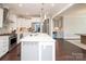 Spacious kitchen with a large island, stainless steel appliances, and seamless flow to dining area at 282 Auburn View Rd, Rock Hill, SC 29730