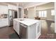 Open kitchen featuring stainless steel appliances, a large island with sink, and dark wood flooring at 282 Auburn View Rd, Rock Hill, SC 29730