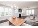 Open-concept living room with dark wood floors, fireplace and many windows for ample light at 282 Auburn View Rd, Rock Hill, SC 29730