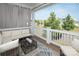 Covered porch with comfortable seating, offering a relaxing outdoor space with neighborhood views at 282 Auburn View Rd, Rock Hill, SC 29730