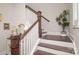 Elegant staircase with dark wood steps, white railings, and stylish decor, leading to upper floors at 282 Auburn View Rd, Rock Hill, SC 29730