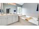 Bright bathroom with double vanity, large soaking tub, and natural light for a spa-like experience at 288 Sand Paver Way # 50, Fort Mill, SC 29708