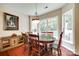 Bright dining room featuring a classic wooden table, six chairs, and large windows offering plenty of natural light at 288 Sand Paver Way # 50, Fort Mill, SC 29708
