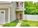 Inviting front entrance with manicured landscaping leading to a warm-toned door on a well-maintained home exterior at 288 Sand Paver Way # 50, Fort Mill, SC 29708