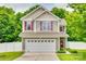 Charming two-story home with a two-car garage, neutral siding, red shutters, and a well-maintained front yard at 288 Sand Paver Way # 50, Fort Mill, SC 29708