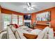 Bright living room featuring a fireplace, large windows, and a comfortable sectional sofa, ideal for relaxation and entertaining at 288 Sand Paver Way # 50, Fort Mill, SC 29708