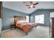 Cozy main bedroom with vaulted ceiling, wood headboard, and bedside lamps for a warm and inviting ambiance at 288 Sand Paver Way # 50, Fort Mill, SC 29708