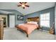 Spacious main bedroom featuring a vaulted ceiling, natural light, and stylish decor for comfortable living at 288 Sand Paver Way # 50, Fort Mill, SC 29708