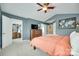 View of main bedroom with walk-in closet, dresser, TV, and soft carpet at 288 Sand Paver Way # 50, Fort Mill, SC 29708