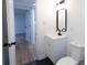 Modern bathroom with black fixtures, white vanity, and adjacent room at 301 Carolina Blvd, Salisbury, NC 28146