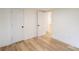 Bright bedroom with laminate floors, white walls, and two closets at 301 Carolina Blvd, Salisbury, NC 28146
