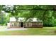 Charming single-story home featuring a metal roof, neutral siding, and a well-maintained front yard at 301 Carolina Blvd, Salisbury, NC 28146