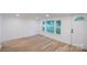 Well-lit living room featuring laminate flooring and a view to the front yard at 301 Carolina Blvd, Salisbury, NC 28146