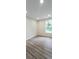 Bright bedroom with hardwood floors, recessed lighting, and a large window at 306 E Ratchford Ave, Gastonia, NC 28054