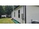 Home exterior featuring vinyl siding, black trim, and a spacious backyard at 306 E Ratchford Ave, Gastonia, NC 28054