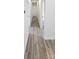 Inviting hallway with durable wood-look flooring and neutral paint, creating a warm transition space at 306 E Ratchford Ave, Gastonia, NC 28054