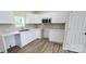 Modern kitchen with white cabinets, stainless steel microwave, and durable countertops at 306 E Ratchford Ave, Gastonia, NC 28054