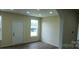 Open living room with modern floors, neutral walls, and natural light at 306 E Ratchford Ave, Gastonia, NC 28054