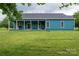 Rear exterior view showcasing the back porch and grassy yard at 3103 Richview Dr, Crouse, NC 28033
