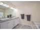 Bathroom featuring double sinks, marble countertops, and ample cabinet space for toiletries at 3103 Richview Dr, Crouse, NC 28033
