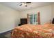 Bedroom with ceiling fan and a large window providing ample natural light at 3103 Richview Dr, Crouse, NC 28033