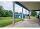 Inviting covered patio with ample seating overlooking a large yard and storage shed at 3103 Richview Dr, Crouse, NC 28033