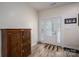 Welcoming foyer featuring a stylish front door and wood-look tile flooring, plus a wooden cabinet at 3103 Richview Dr, Crouse, NC 28033
