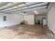 Bright two car garage with white walls, concrete floor and access to the house at 3103 Richview Dr, Crouse, NC 28033