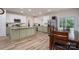 Expansive kitchen with stainless steel appliances, island, dining table, and slider to the backyard at 3103 Richview Dr, Crouse, NC 28033