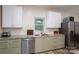 This kitchen has stainless steel appliances, sage cabinets, and granite countertops at 3103 Richview Dr, Crouse, NC 28033